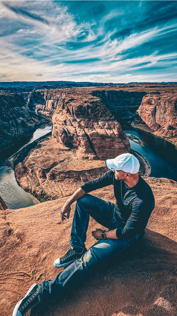 George Hester sitting and looking out at the Horseshoe Bend in Page, Arizona